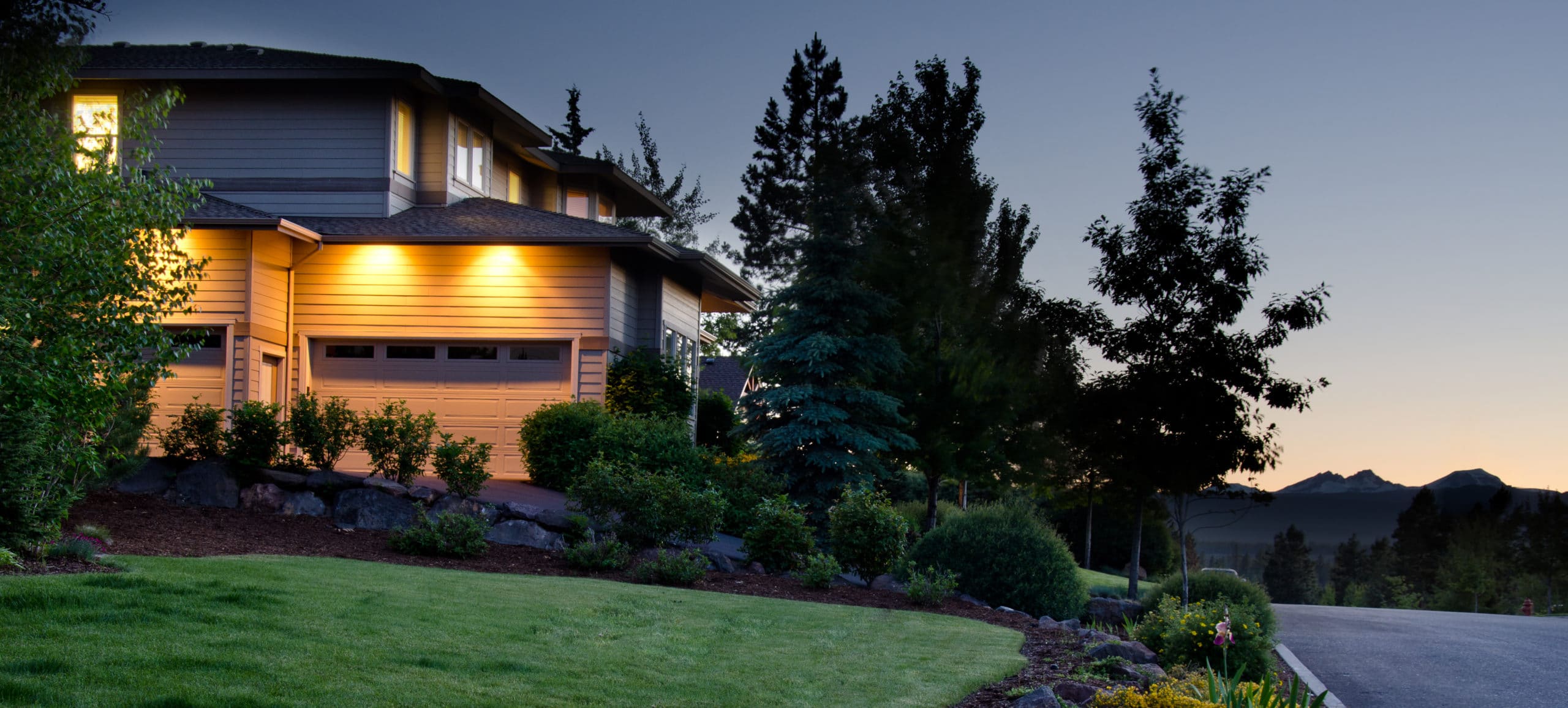 twilight exterior of home and lawn